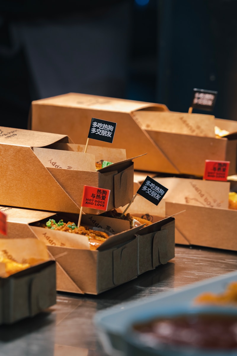 Several boxes of food sitting on a table